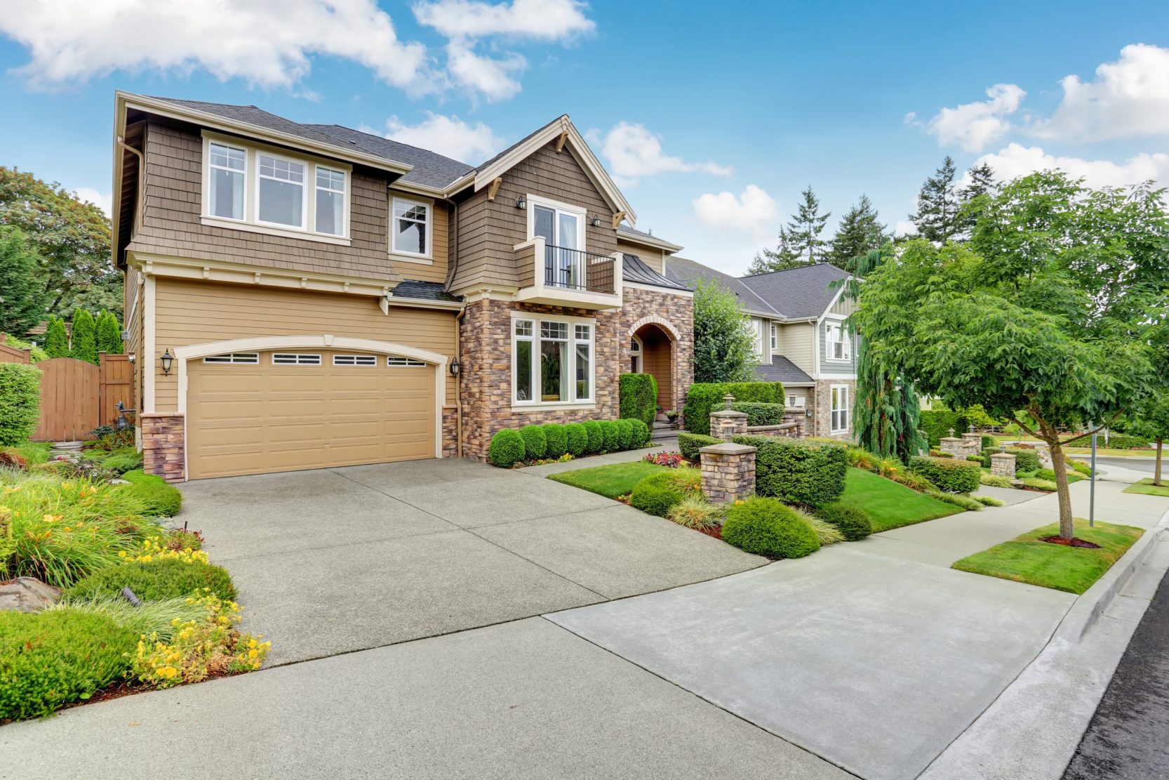Beautiful curb appeal of American house with stone trim